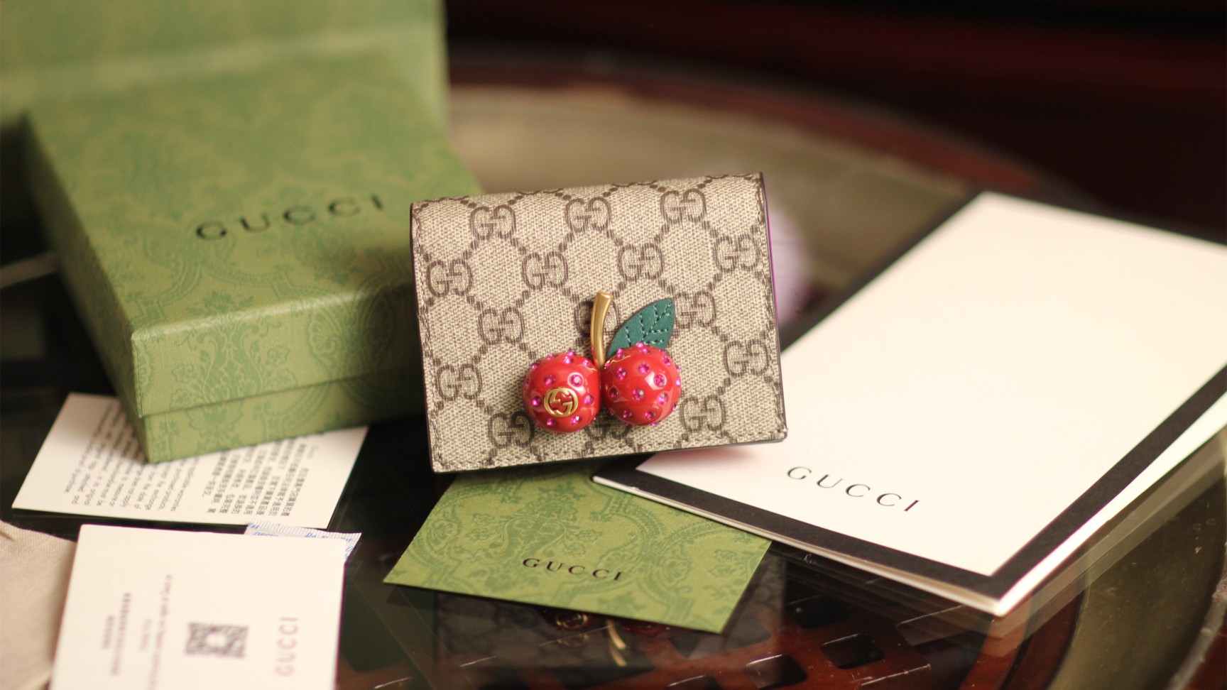 G*u*i cherry wallet