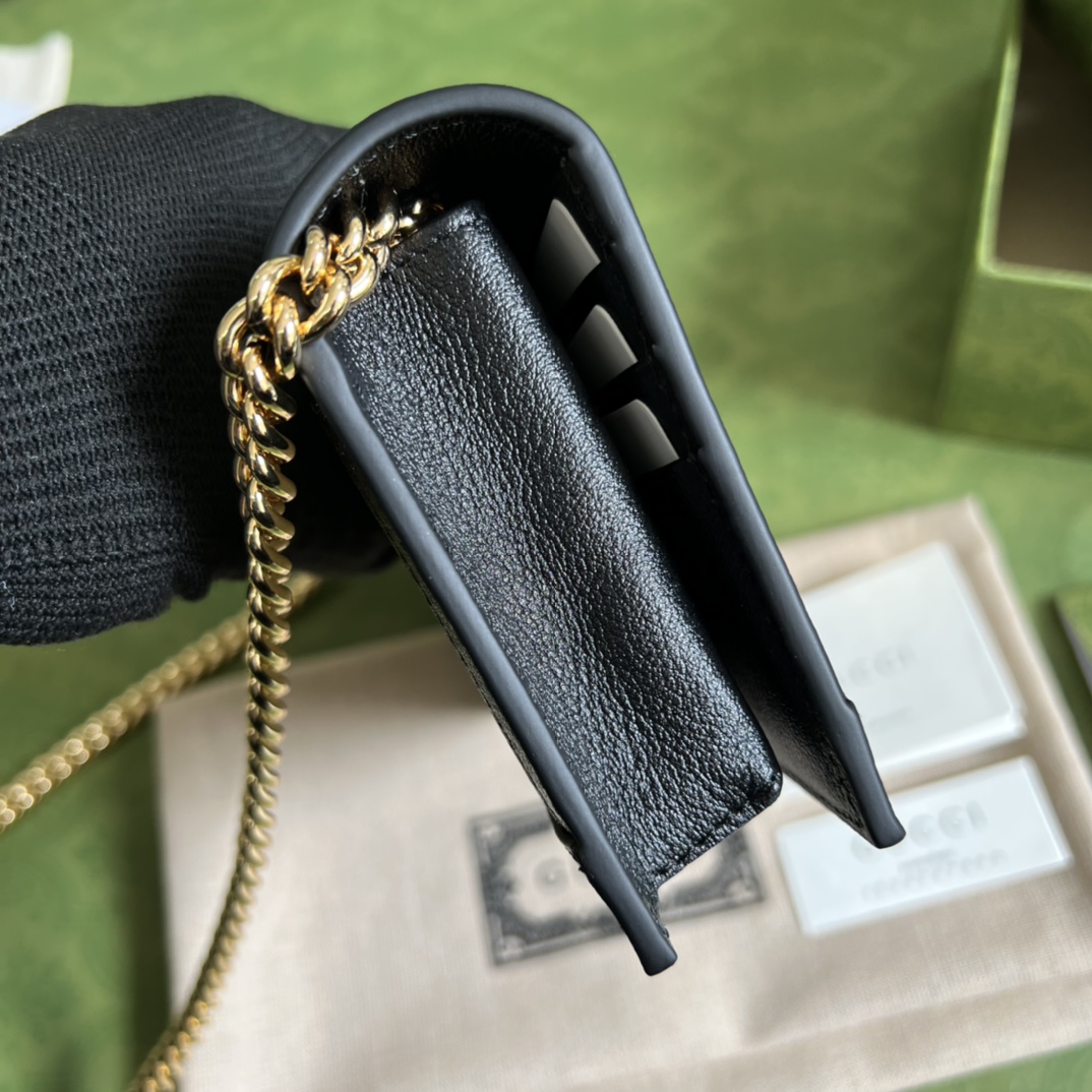 G*u*i leather clutch