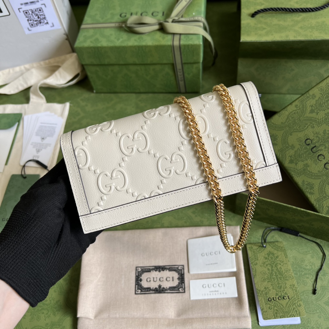 G*u*i leather clutch