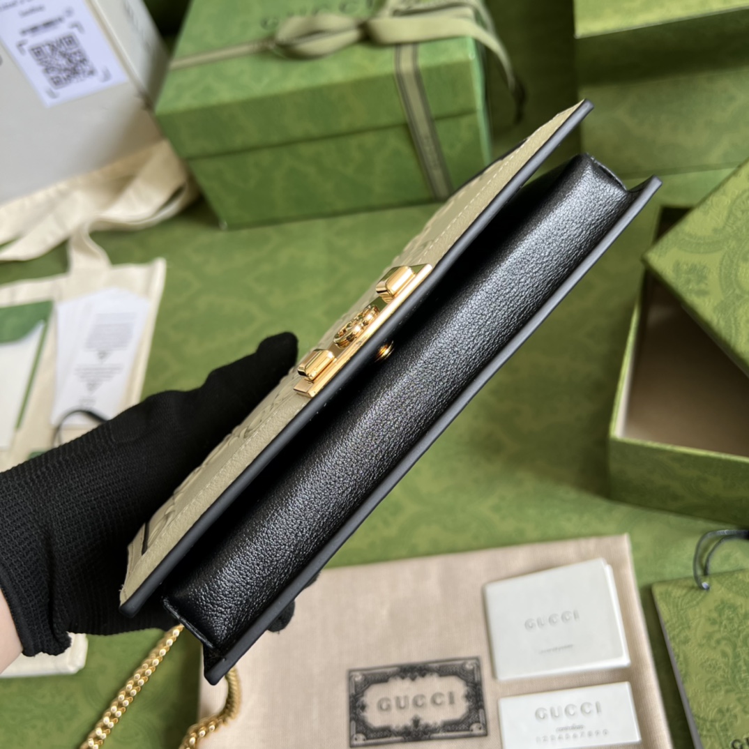 G*u*i leather clutch