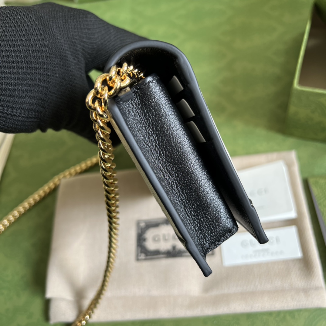 G*u*i leather clutch