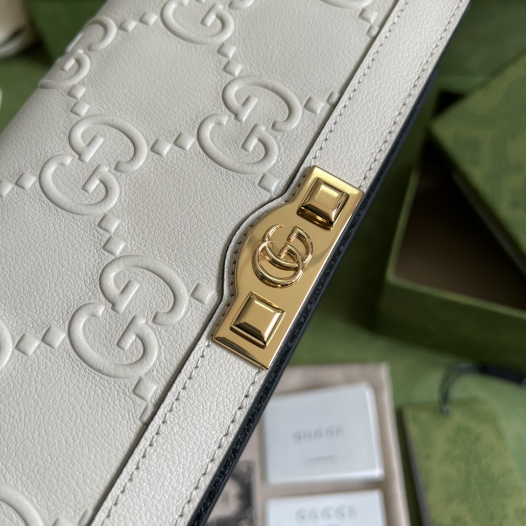 G*u*i leather clutch