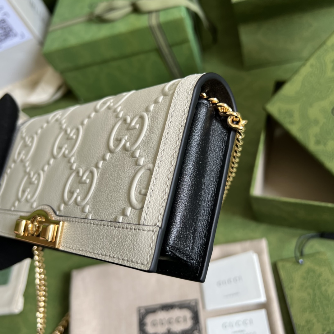 G*u*i leather clutch