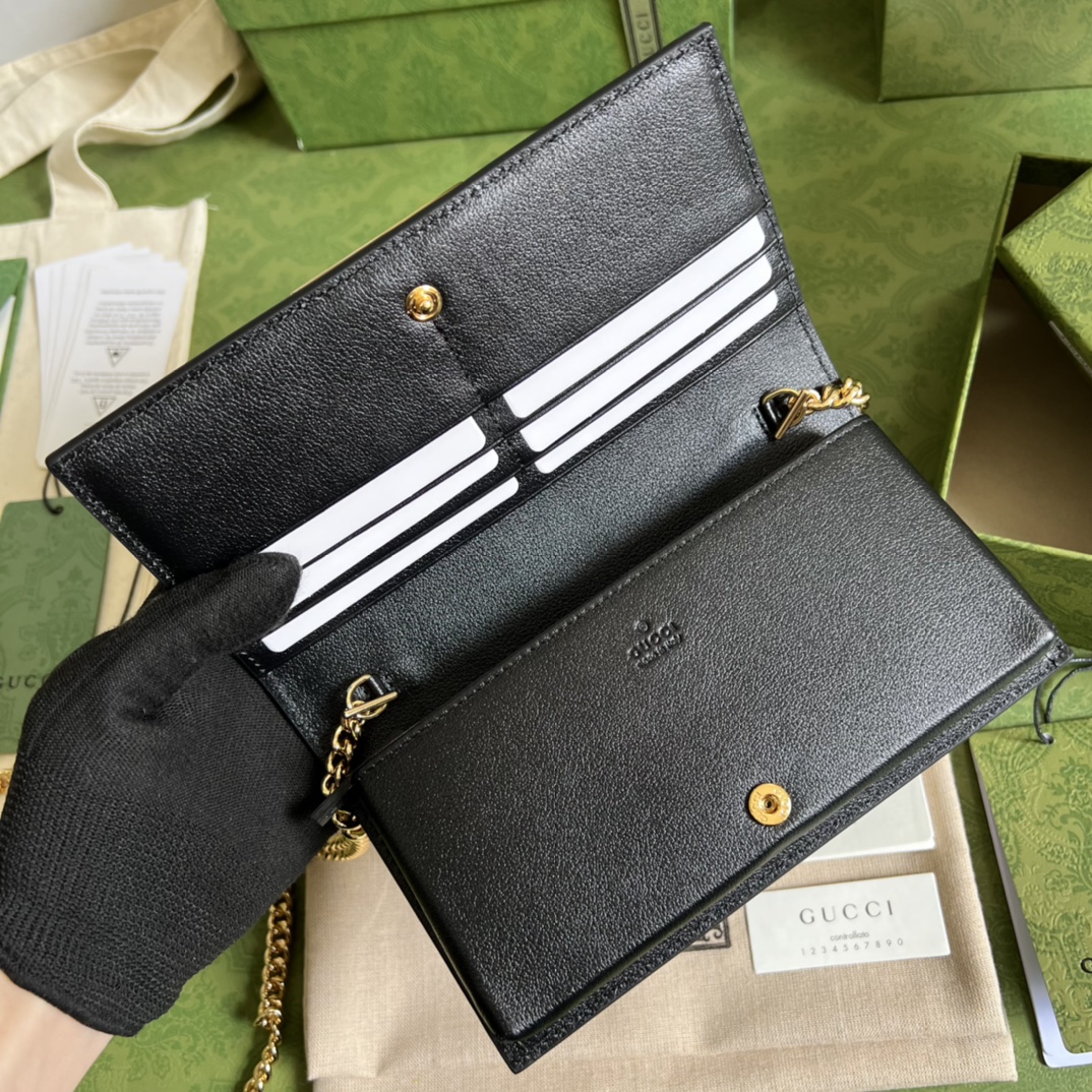 G*u*i leather clutch