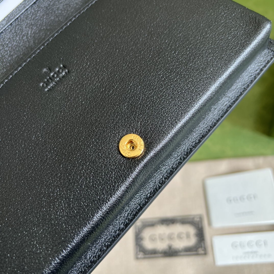G*u*i leather clutch