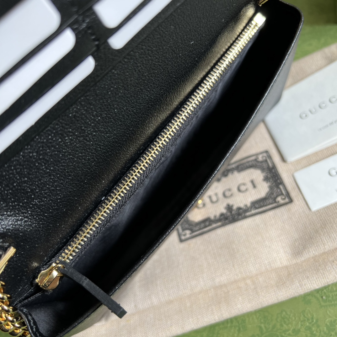 G*u*i leather clutch