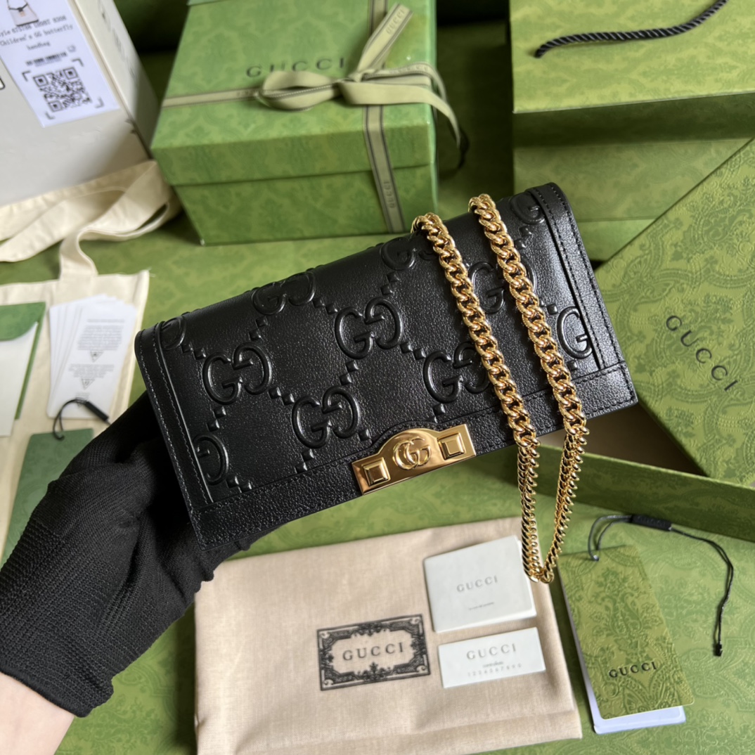 G*u*i leather clutch