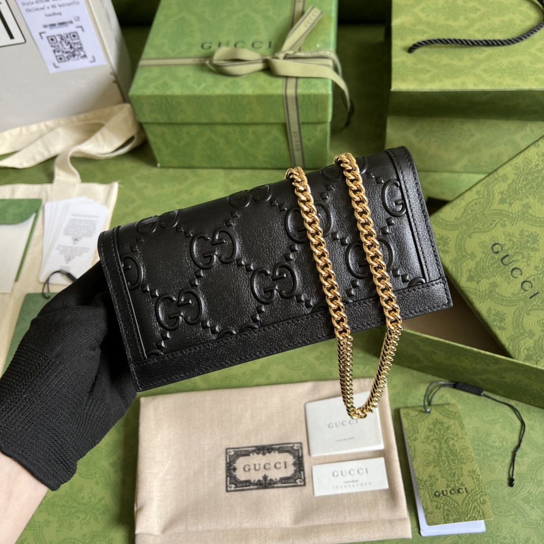 G*u*i leather clutch