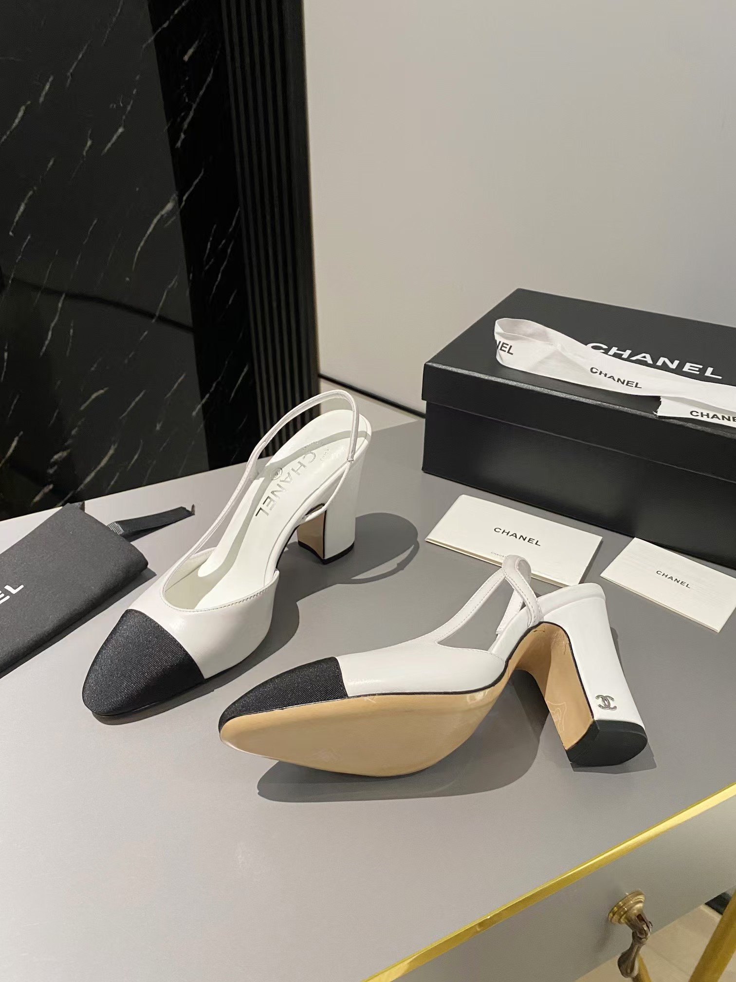 Ch*el two-tone cap toe slingback pumps