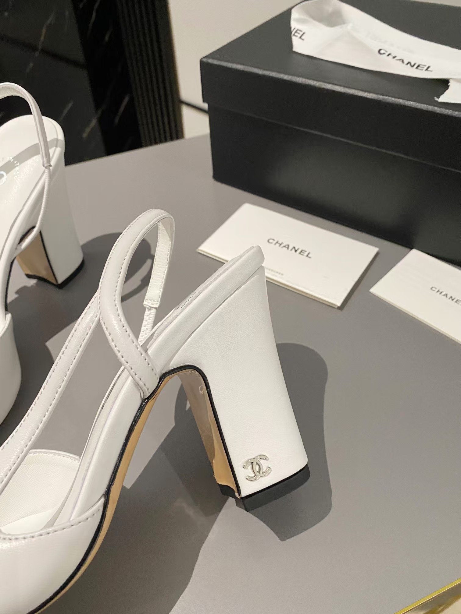 Ch*el two-tone cap toe slingback pumps