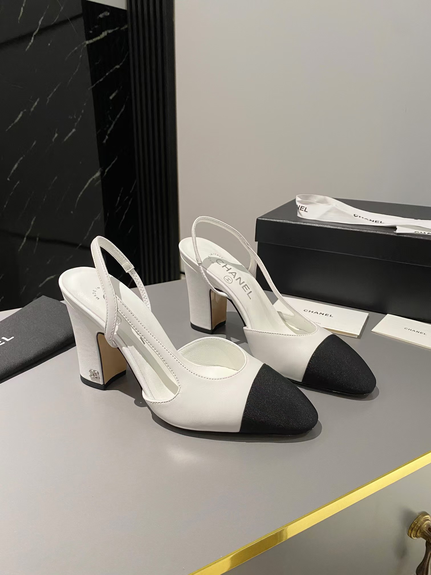 Ch*el two-tone cap toe slingback pumps