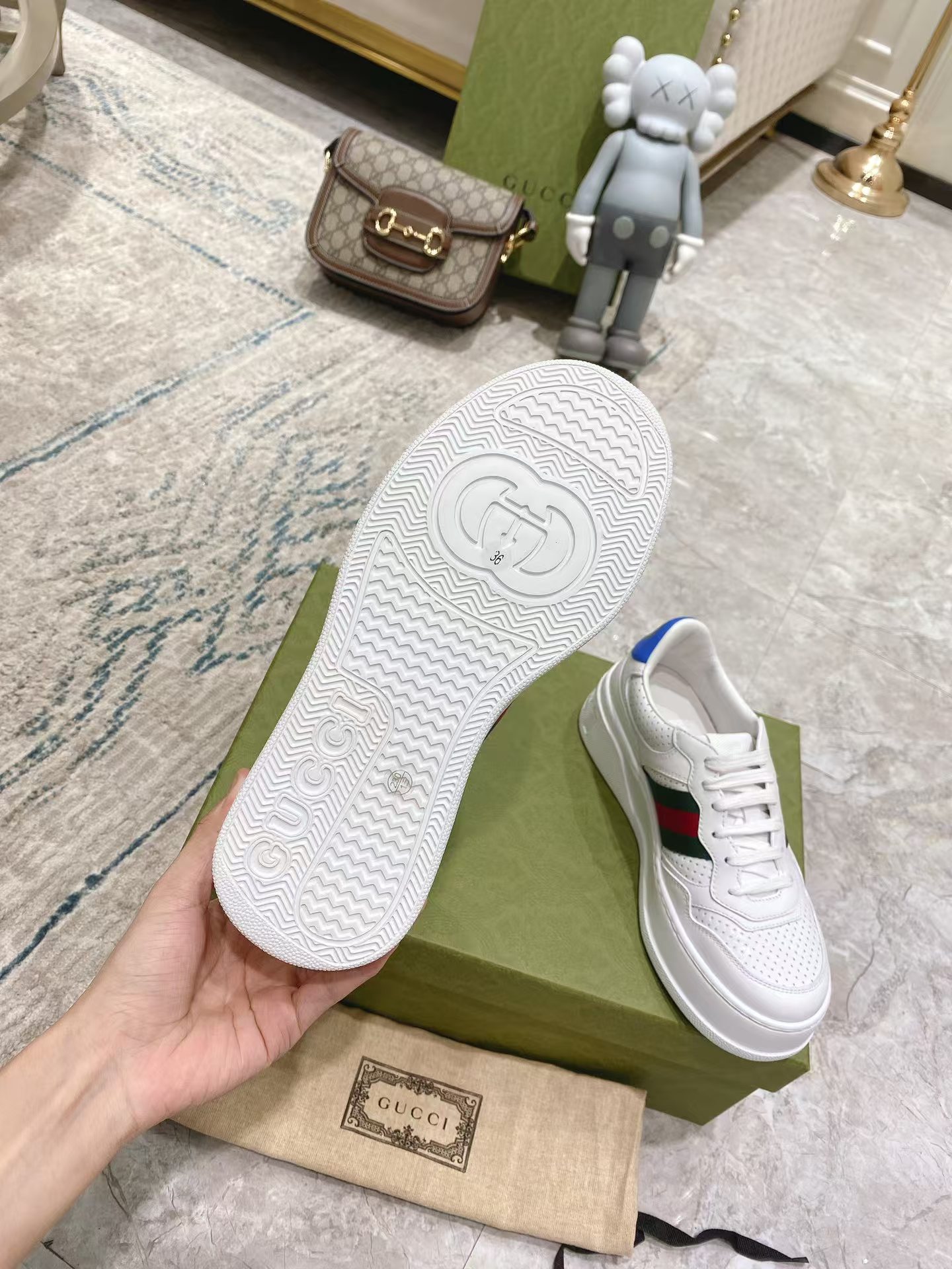 G*u*i leather sneaker with web